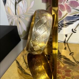 Brass bangle with geometric etching.